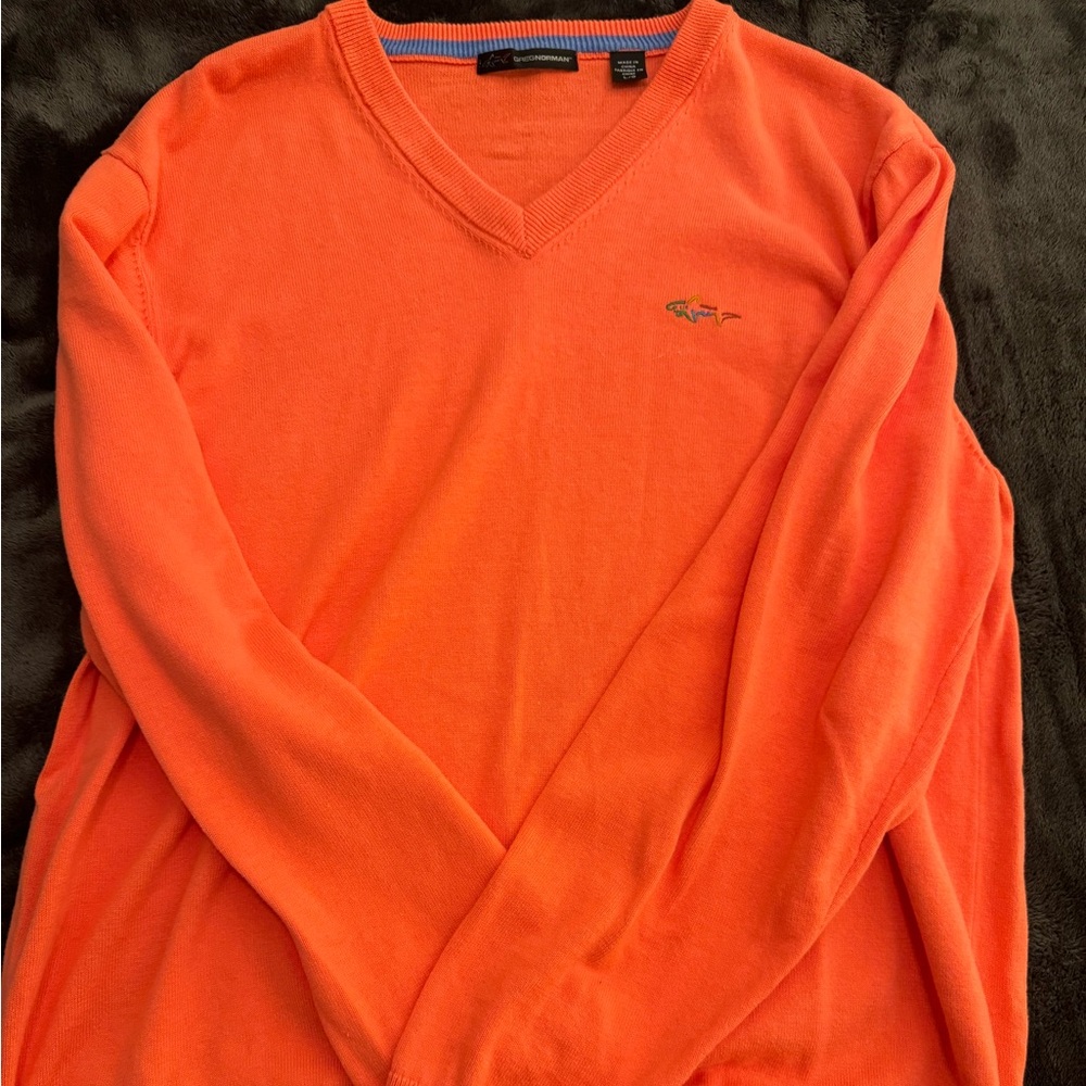 Greg Norman pink V neck sweater.